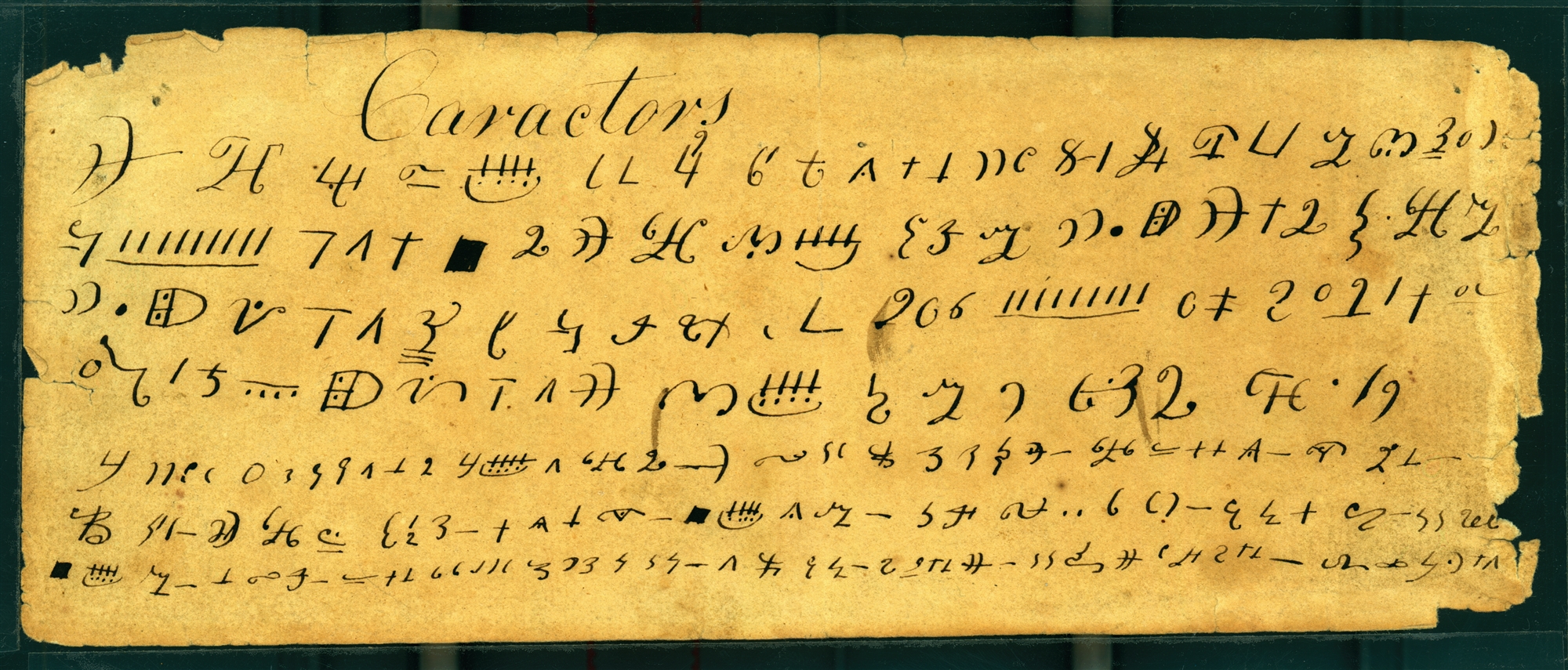 The Caractors document, a handwritten slip of paper covered with rows of small angular characters arranged in seven horizontal lines. Believed to be a transcription by John Whitmer (ca. 1829-1831) of characters Joseph Smith copied from the gold plates; an earlier transcript was the one Martin Harris carried to Charles Anthon in 1828.