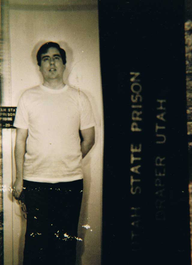 Mark Hofmann photographed at Utah State Prison intake on January 29, 1987, age 33, in a standard front-facing booking image taken by Utah Department of Corrections personnel after his guilty plea to two counts of second-degree murder.