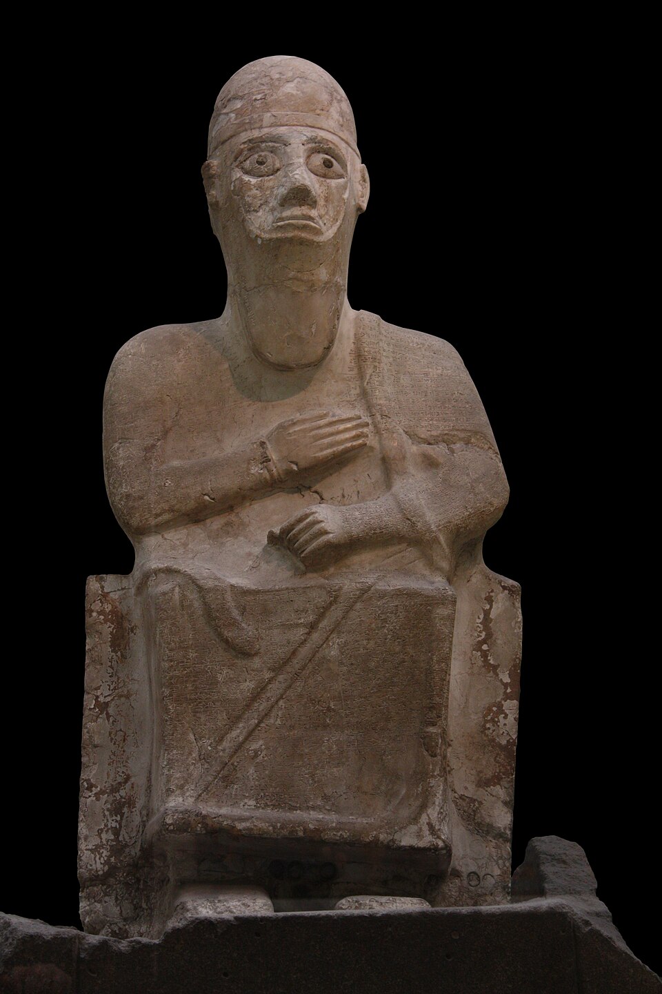 The Statue of Idrimi, a magnesite seated-figure statue of the 15th-century BC king of Alalakh, discovered at Tell Atchana in 1939 and now at the British Museum, bearing a 104-line cuneiform autobiographical inscription across the front.