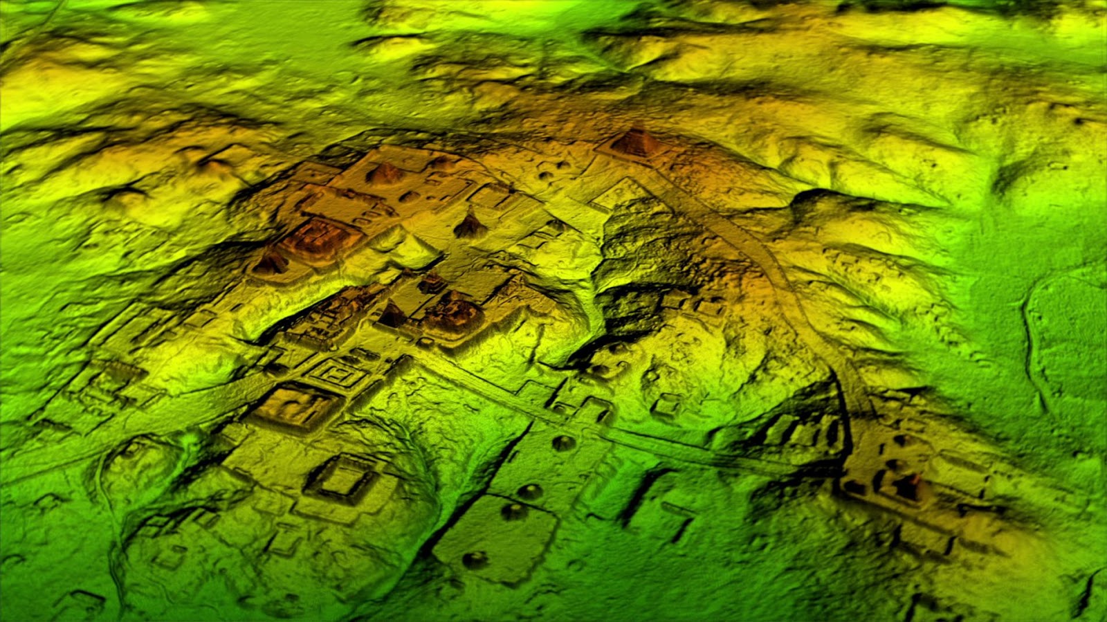 LiDAR-rendered visualization of the northern Petén in Guatemala, revealing dense networks of previously-undocumented Maya structures, causeways, and earthworks beneath jungle cover. The terrain shows distinct rectangular building footprints, raised platforms, and linear road features that are invisible from the ground.