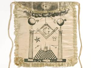 Joseph Smith's personal Masonic apron — white silk backed with muslin, decorated with hand-painted Masonic symbols in the eighteenth- and nineteenth-century English Speculative tradition, held by the Community of Christ Library-Archives in Independence, Missouri.